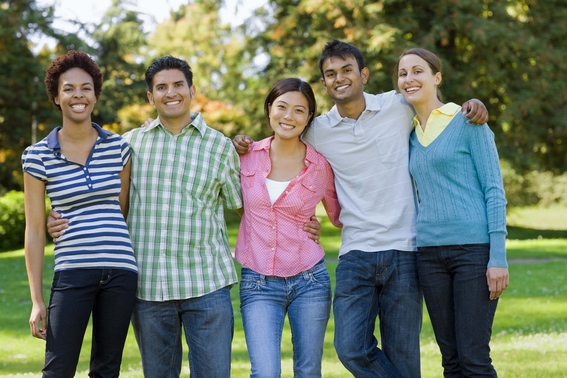 PictureImage: Five adults smiling in a line with their arms around each other